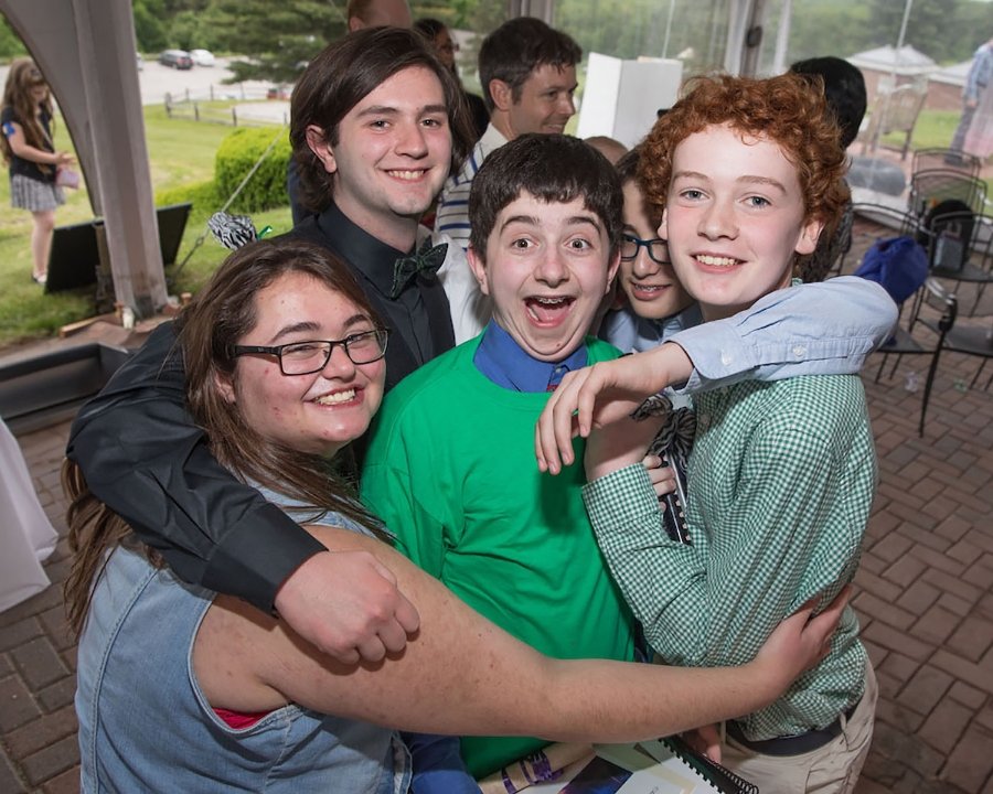 group of students embracing