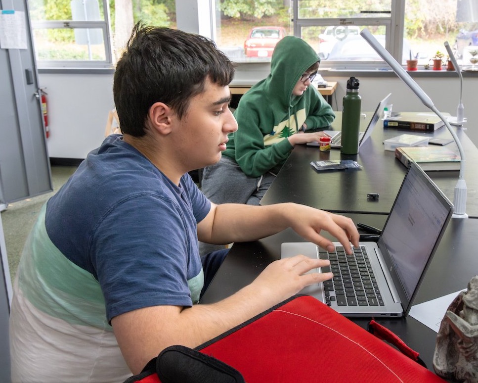 student at computer in math & science lab