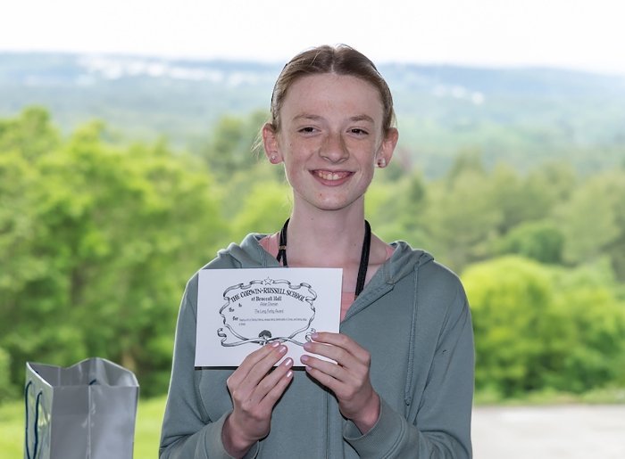 student holding a certificate