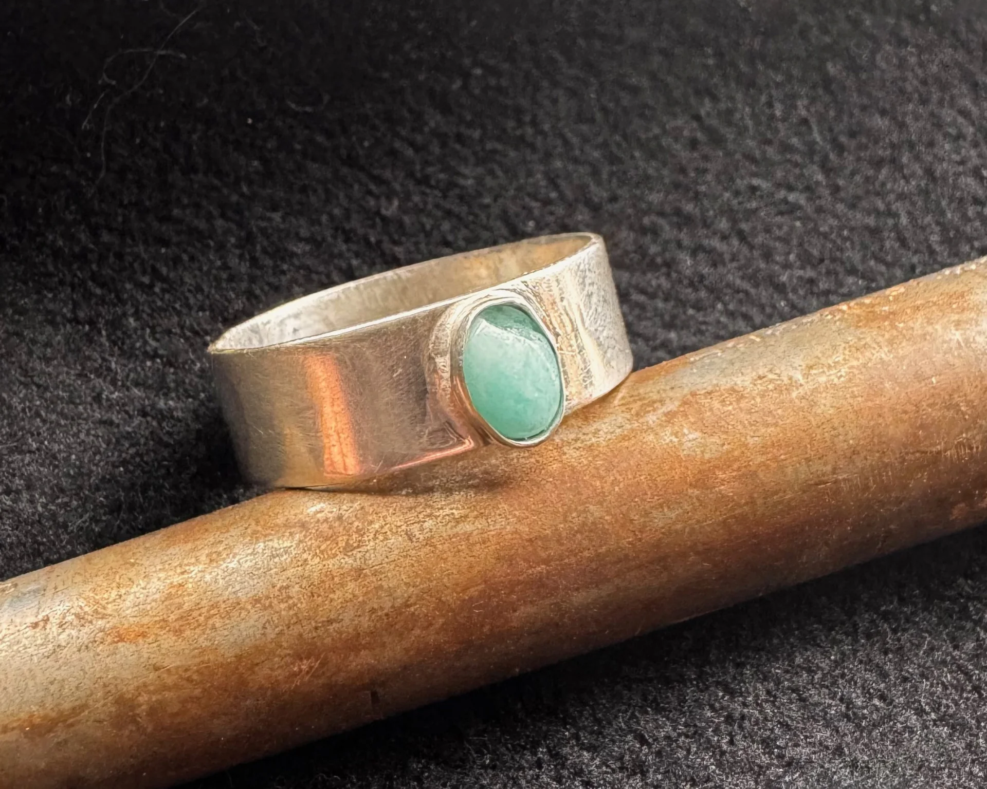 Silver ring with green stone