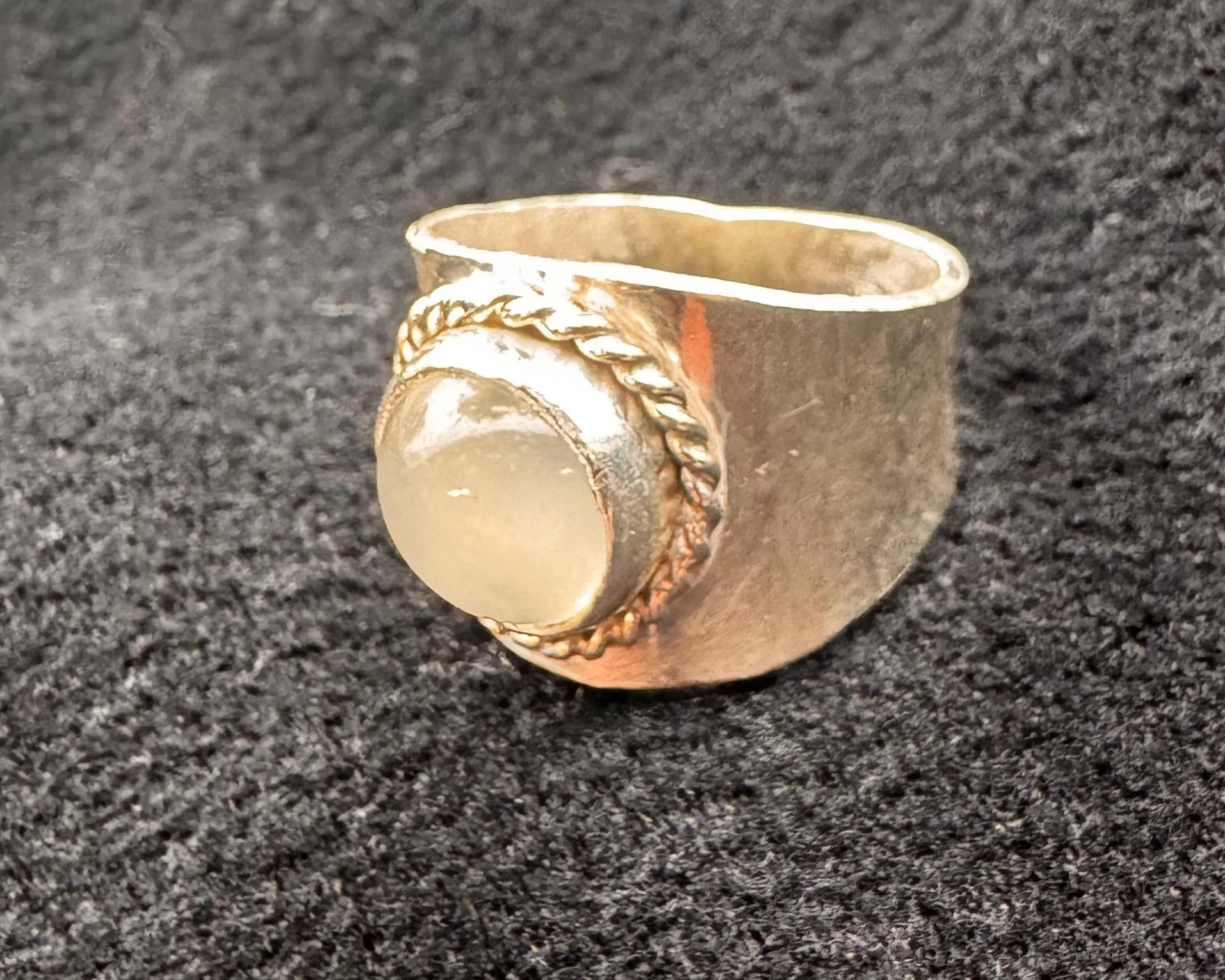 Silver ring with white stone