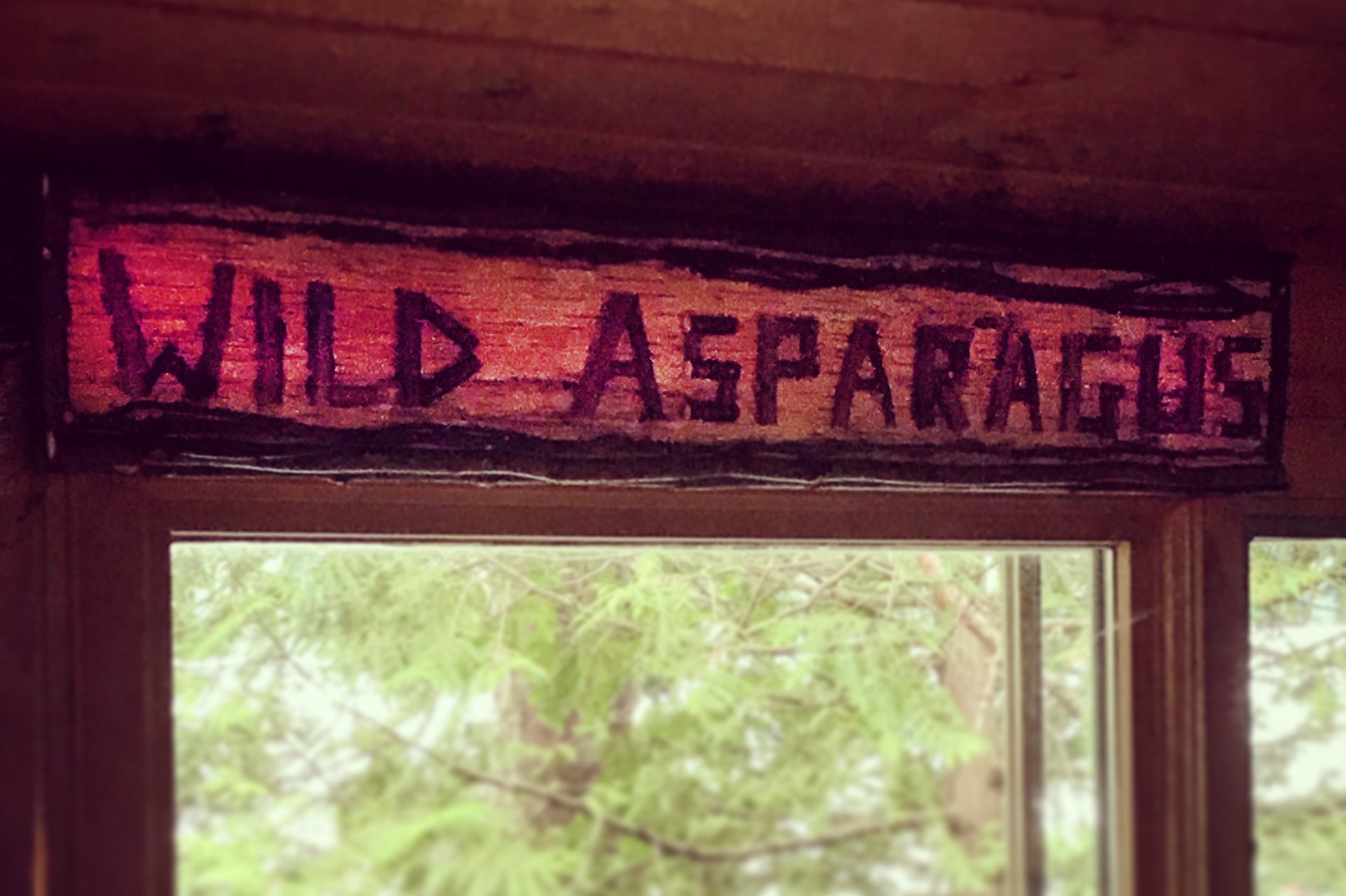 Window with Wild Asparagus sign above it
